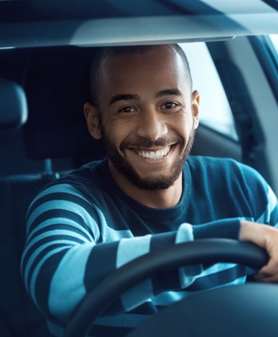 Man sat in driver's seat of a car
